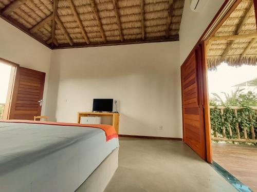 Ένα ή περισσότερα κρεβάτια σε δωμάτιο στο Casa dos Irmãos