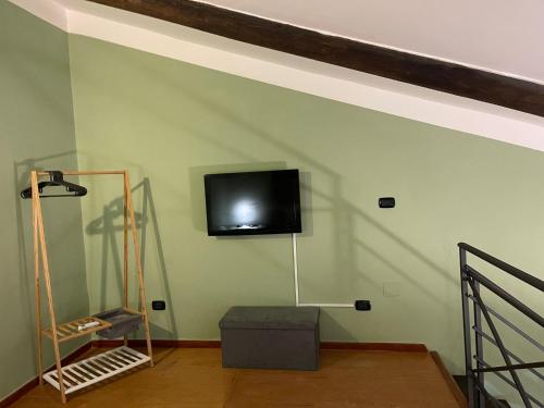 Televízia a/alebo spoločenská miestnosť v ubytovaní La Baita In Città