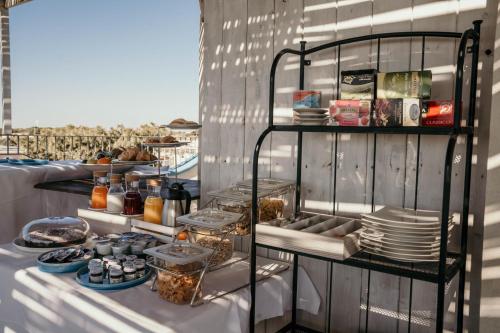a table with plates and food on a shelf at Casa Mita in Pulsano