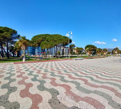 a park with aavy pattern on the ground at Hotel Nettuno in Soverato Marina