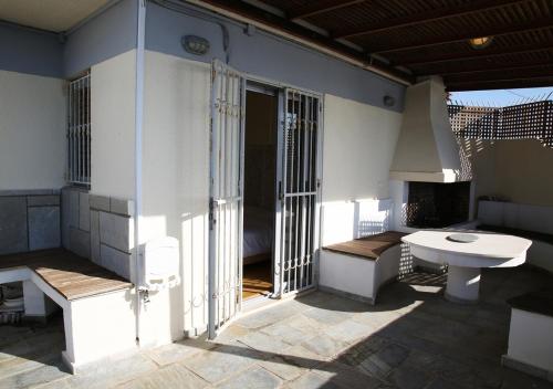 a kitchen with a sink and a stove at Penthouse -Breathtaking sea view-Just on the beach in Loutraki