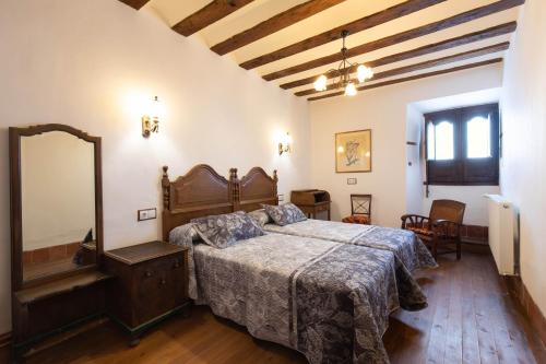 Кровать или кровати в номере Casona Indiana de Ayuelas