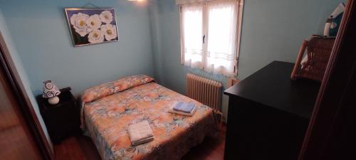 Ένα ή περισσότερα κρεβάτια σε δωμάτιο στο Apartamento El Ñeru