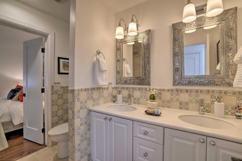 a bathroom with two sinks and two mirrors at Modern Bungalow with Santa Fe Charm Less Than 2 Mi to Plaza in Santa Fe