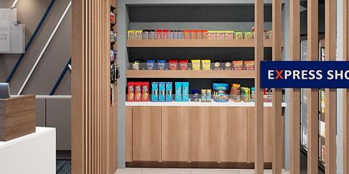 a door in a store with a room with food on it at Holiday Inn Express - Gloucester by IHG in Gloucester