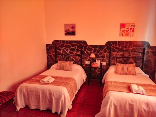 Lova arba lovos apgyvendinimo įstaigoje Casa Rural La Aduana