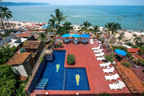 an aerial view of a resort with a pool and the beach at El Dorado 404 in Puerto Vallarta
