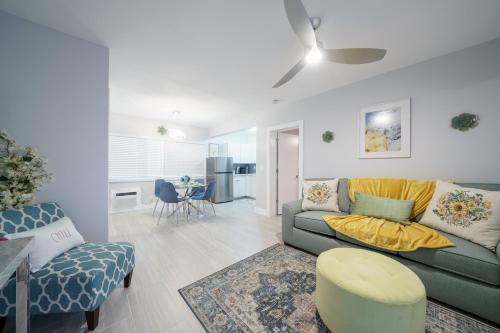 a living room with a couch and a chair at The Surf Hollywood Beach in Hollywood