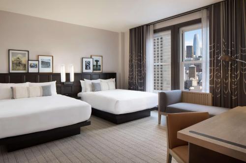 a hotel room with two beds and a window at The Clift Royal Sonesta San Francisco in San Francisco