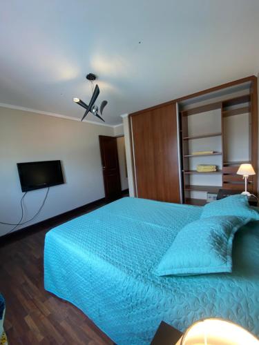 מיטה או מיטות בחדר ב-Departamento Lindo Colonial Salta