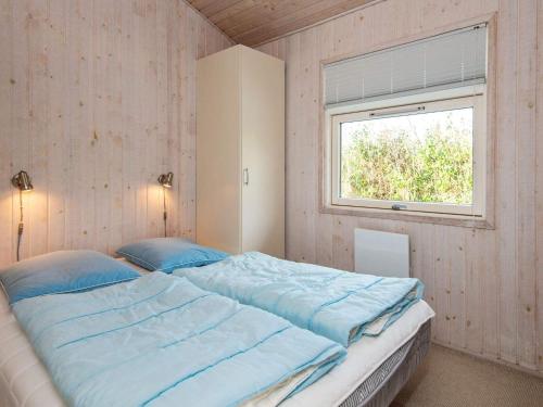 Кровать или кровати в номере Holiday home Juelsminde LXXIX