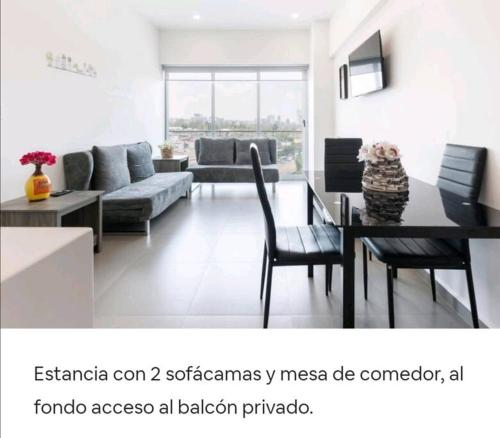 a living room with a couch and a table and chairs at San Ángel UNAM 3 recámaras/2parking in Mexico City