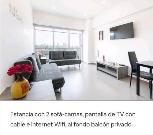 a living room with a couch and a table at San Ángel UNAM 3 recámaras/2parking in Mexico City