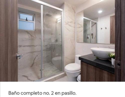 a bathroom with a shower and a toilet and a sink at San Ángel UNAM 3 recámaras/2parking in Mexico City