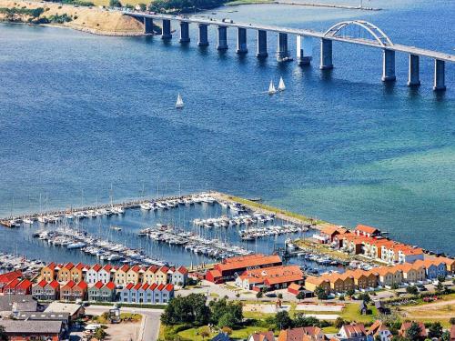 an aerial view of a harbor with boats and a bridge at 4 person holiday home in Rudk bing in Rudkøbing
