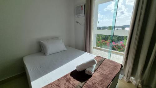 Ένα ή περισσότερα κρεβάτια σε δωμάτιο στο Solar Teixeira FLATS