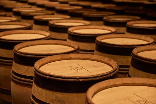 a group of wooden barrels sitting next to each other at Runaway Cow Winery Retreat in Yantai