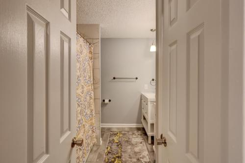 a bathroom with a shower curtain and a sink at #111 Elaborate Condo Ideal Location 2BRM/2 Parking in Hilton Head Island