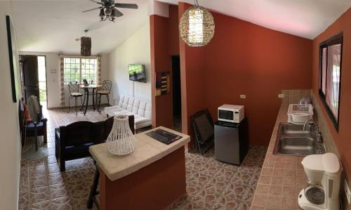 a room with a kitchen and a living room at Stone Cabins Boquete in Boquete