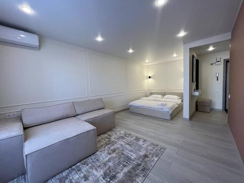 Ένα ή περισσότερα κρεβάτια σε δωμάτιο στο Аппартаменты BATMAN-HOUSE