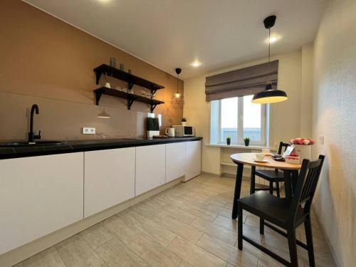 Η κουζίνα ή μικρή κουζίνα στο Аппартаменты BATMAN-HOUSE