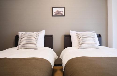 Un pat sau paturi într-o cameră la 51st Prosper - Vacation STAY 28916v