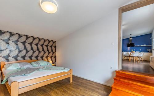 a bedroom with a bed and a large mirror at Medulinka apartments in Medulin
