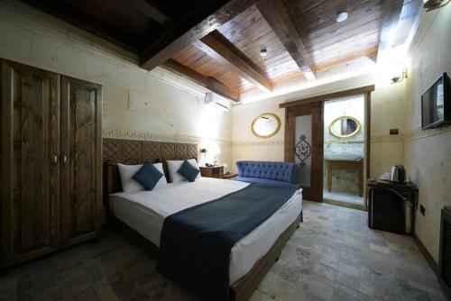 Ένα ή περισσότερα κρεβάτια σε δωμάτιο στο Arte Cave Hotel