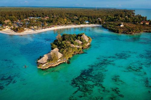 an island with a resort in the water at The Island - Pongwe Lodge in Pongwe