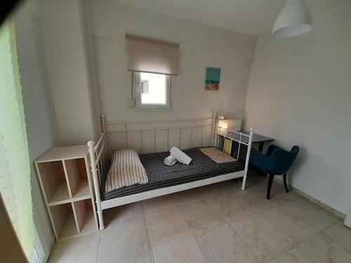 a small bedroom with a bunk bed and a desk at Dimos Sunny & Luxury Central House !!! in Perea