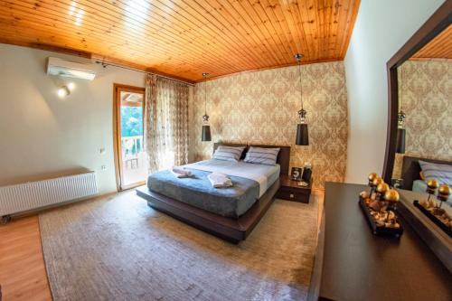 En eller flere senge i et værelse på Vintage Villa