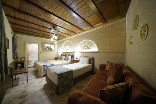 Ένα ή περισσότερα κρεβάτια σε δωμάτιο στο Arte Cave Hotel