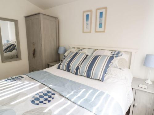 A bed or beds in a room at Chalet 216- The Beach Retreat