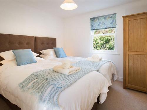 Säng eller sängar i ett rum på Bakery Cottage - Lake District