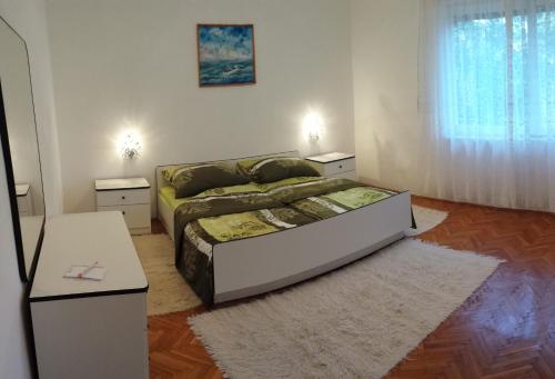 Cama ou camas em um quarto em Apartment Mirjana