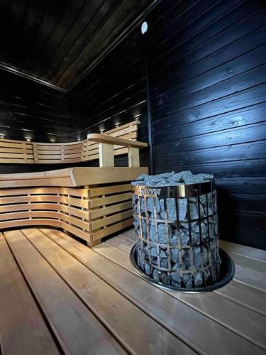 a room with a barrel and a bench in a building at Villa Lyxfällan in Kemionsaari