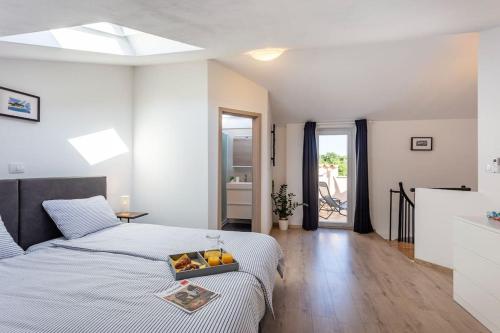 Postel nebo postele na pokoji v ubytování Apartments Punta Premantura