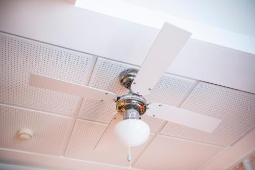 a ceiling fan with a light on a ceiling at Kings Garden 1 by Daniel&jacob's in Copenhagen