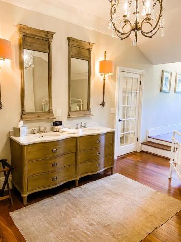 a bathroom with two sinks and a chandelier at The Twelve Oaks Bed & Breakfast in Covington