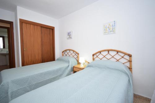 מיטה או מיטות בחדר ב-PRINCIPADO MARINA - Fincas Arena