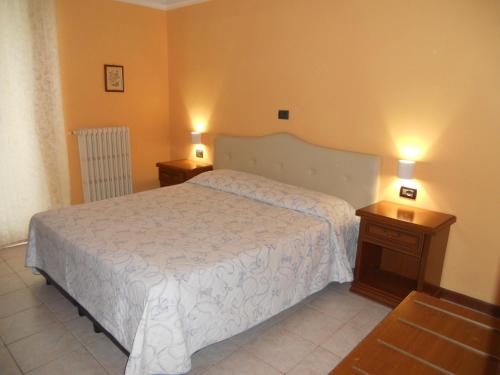 Ένα ή περισσότερα κρεβάτια σε δωμάτιο στο Hotel Salus