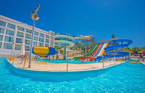 a water park with a slide in the water at Anastasia Waterpark Beach Resort in Protaras
