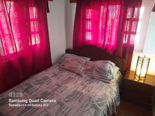 A bed or beds in a room at Villa Lourdes