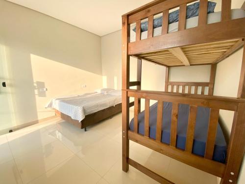 Postel nebo postele na pokoji v ubytování Casa Temporada Paris Thermas dos Laranjais3-Suites