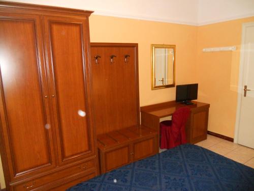 Ένα ή περισσότερα κρεβάτια σε δωμάτιο στο Hotel Salus