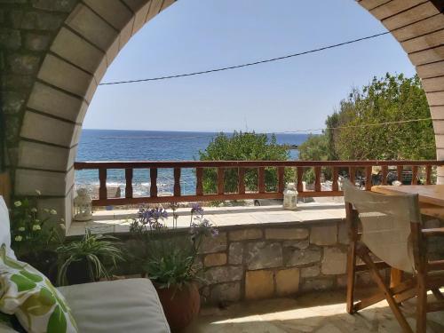 a view of the ocean from the balcony of a house at Almyra apt in Mani in Kotrónion