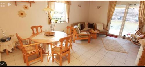 a living room with a table and chairs at House Natalie in Gyenesdiás