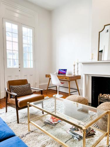 a living room with a couch and a table at Bon Maison Guest House in New Orleans