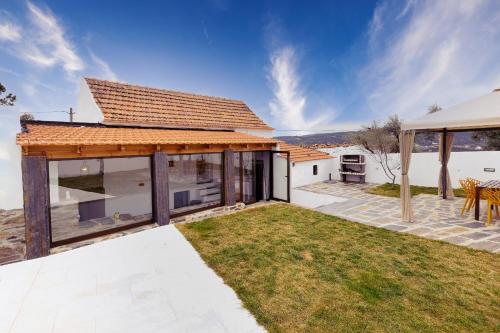 an image of a house with a roof at Pomar das Oliveiras - Private Swimming pool - Free EV Chrg - Pet Friendly in Carvalhal Cimeiro