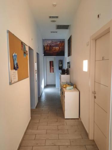a hallway with a room with a hallwayngth at Superior Motel in Haifa
